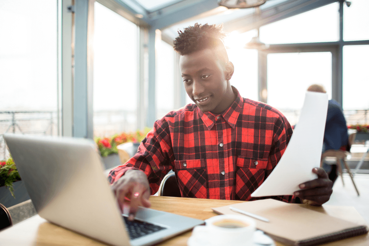 young African American man working on a laptop