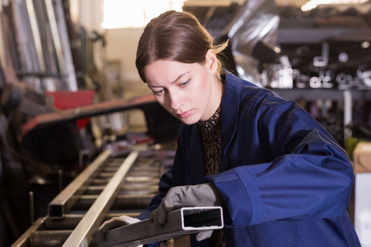 young woman working on an assembly line